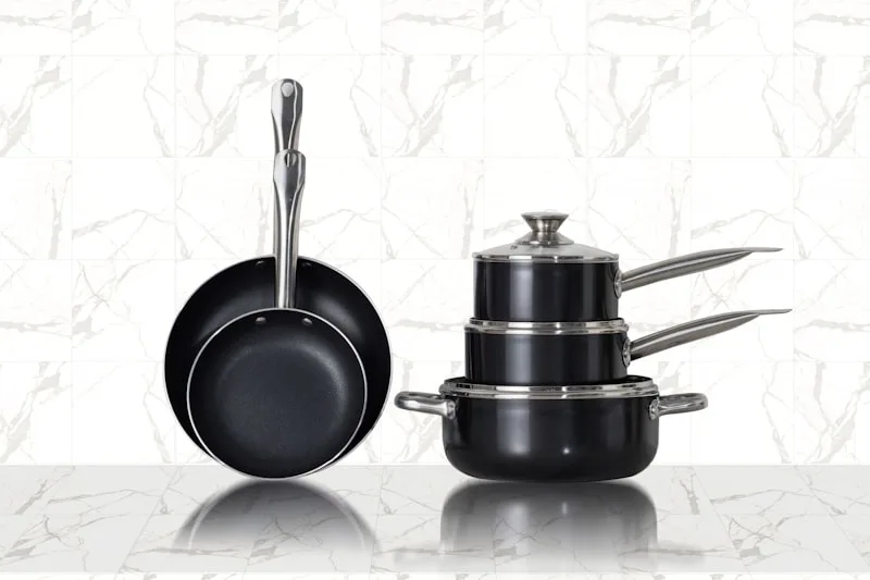 Cookware set arranged on a kitchen stovetop